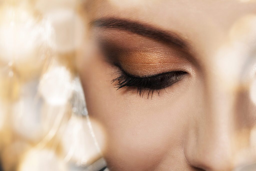 A close up of the eye of a woman with makeup