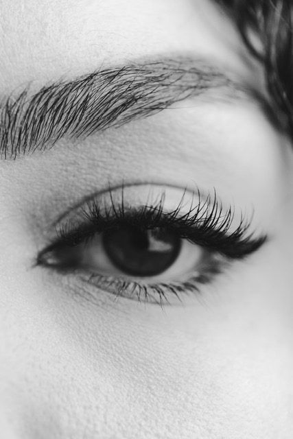 A close up of the eye of a woman